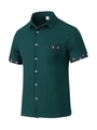Detail of waffle texture and bird print on dark green short sleeve shirt pocket - Dark Green