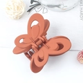 Elegant matte terracotta butterfly hair claw clip with a hollow wing design for women - Orange Red