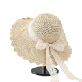 Women's beige straw sun hat featuring elegant white lace bow and wavy brim design - L (58-60cm) / Star Applique Decor Beige