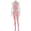 Dettaglio della stampa paisley rossa e bianca su top all'americana e pantaloni slim - S / Stampa Rossa e Bianca