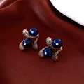 Detail of vintage teardrop earrings with blue beads and small crystals on silk fabric - Earrings-Gold-Blue-Silver Earring Post