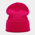 Detail of rose red cuffed knit beanie showing soft textured fabric for autumn and winter - Rose Red
