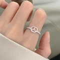 Sterling silver twisted band ring featuring a hollow heart design in a sleek silver finish - Silver Hollow Pattern (JZ1112)