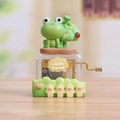 Boîte à musique à manivelle avec figurine de grenouille et mécanisme transparent - Grenouille