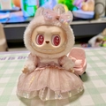 Labubu plush doll wearing pink rabbit headwear and soft tulle skirt on a chair - Deep Pastel Sequined Tulle Skirt / First And Second Generation Keychains Are Compatible With La Cloth Dolls. Dolls Not Included.