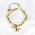 Detail of adjustable gold bead bracelet with zircon-encrusted letter Z pendant charm - Letter Z