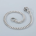 Close-up of polished silver stainless steel Cuban link chain with lobster clasp and metal ring - 16" / Sabertooth Tiger Clasp