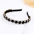 Luxurious velvet headband featuring sparkling crystals and black diamonds in gold settings - Black