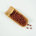 Realistic PVC reddish-brown capsule grains model displayed on a natural bamboo scoop - Long Red Beans (500g)