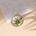 Handmade clear resin round pendant with real white flowers and gold leaf in gold frame - White Green/Gold