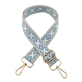 Close-up of blue and white geometric woven strap with adjustable gold metal hardware - T10-Light Blue