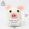 Close-up of a handmade crochet pig doll holding an inspirational card for stress relief - White Pig Double Layer Ear