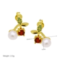 Detailed view of cherry earrings with red gems, white pearls and green crystal leaves - Gemstone Pearl Cherry Drop Earrings / 10mm x 15mm
