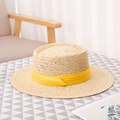 Handwoven straw sun hat with yellow ribbon on table for summer vacation - Universal Size / Yellow