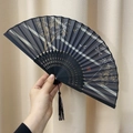 Classic folding fan with bamboo frame featuring dragonfly and bamboo leaf pattern - Bamboo Peace
