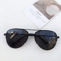 Classic black double-bridge aviator sunglasses with polarized lenses on white desk - Black Frame Full Grey