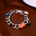 Silver Cuban chain bracelet featuring vibrant multi-colored polygon-cut gemstones - Silver Colored Gemstone Thick Chain