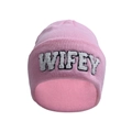 Close-up of pink knit beanie featuring WIFEY towel embroidery and soft textured fabric - Pink