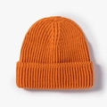 Classic orange rib-knit beanie with wide folded cuff for winter warmth and outdoor style - Orange Yellow