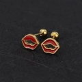Macro view of gold-plated red enamel lip stud earrings with screw-back closures - Lip / Gold