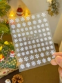 Detail shot of white 3D snowflake nail art stickers for festive Christmas manicures - 5D Relief White Snowflake YT3739