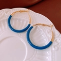 Detailed view of C-shaped blue and gold earrings on a textured white ceramic plate - 6# Silver Earring Post - Gold - Blue / Blue and Gold Two-Tone Patchwork Style