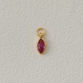 Golden pendant with marquise-cut red zircon birthstone on a minimalist background - July-Dark Red