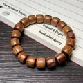 Bracelet ethnique en bois de santal vert avec perles cylindriques et texture naturelle - Palissandre Noir 10x11mm