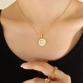 Gold Scorpio zodiac necklace with white seashell pendant on stainless steel chain - Gold Scorpio