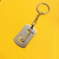 Silver stainless steel keychain featuring a hollow letter J pendant on a yellow background - Letter J