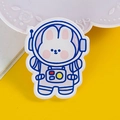 Cute acrylic astronaut bunny brooch in blue and white on bright yellow background - 13 Astronaut Rabbit