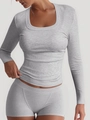 Close-up of grey ribbed knit texture and U-neck design on a sporty long sleeve top - Mottled Grey