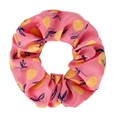 Detail of pink fabric scrunchie featuring vibrant yellow lemon and navy leaf patterns - Orange Pink