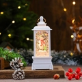 Close-up of a white musical Christmas snow globe lantern with snowman and warm LED light - White Snowman (Rotating)