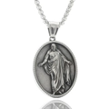 Macro detail of oval stainless steel pendant featuring a classic relief portrait and box chain - Religious Figure