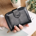 Women's compact black faux leather bifold wallet with gold zipper and buckle detail - Black