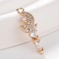 Golden moon pendant with white zircons for DIY jewelry making on white satin background - Gold Moon Flower