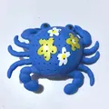 Blue crab-shaped water toy with multiple drainage holes and floral pattern design - Floral Print Blue Crab