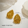 Macro detail of gold teardrop earrings with hammered texture and dimension specifications - Hammered Teardrop Style