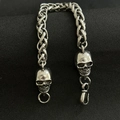 Close-up of hip-hop men's chunky braided chain bracelet featuring detailed skull heads - No.2 Skull 21cm