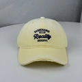 Close-up of distressed cream baseball cap featuring vintage embroidery and wide brim - One Size (58-60cm) / Yellow