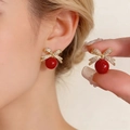 Bowknot earrings with shimmering white micro-diamonds and a bold red round pearl bead - Rhinestone Bowknot Red Bead Style (4076)