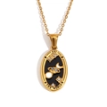 Gold-plated tarot necklace featuring The World pendant with black enamel and blue crystals - Oval Tarot - The World / Gold