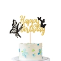 Glittering gold Happy Birthday cake topper featuring black butterfly cutouts and wooden stick - Black