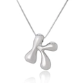 Macro shot of silver letter K pendant with polished finish on a delicate link chain - Letter K