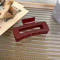 Detail of burgundy rectangular hair claw clip on a glass tray with vintage decor - Rectangular Style (E)