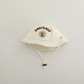 Detail of adjustable windproof strap and bear embroidery on toddler bucket hat - 48-50cm / Beige