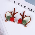 Detail of Christmas reindeer antler hair clips with festive red and green pompoms - Teddy Red Green Ball Brown