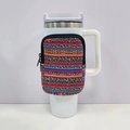 Detail of colorful striped leopard pouch attached to a 40oz insulated tumbler handle - No. 4 Stripe Leopard