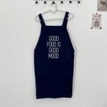 Detail of navy canvas apron featuring 'GOOD FOOD IS GOOD MOOD' text and durable pocket - GOOD FOOD IS Blue